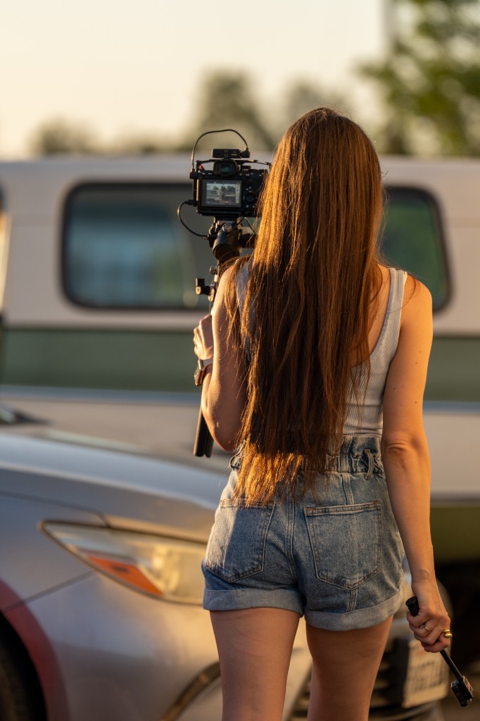 Videographer filming with a camera gimbal on location